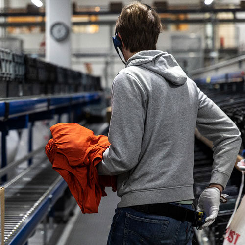 A logistics worker by machines